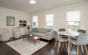 Newly renovated living room dining area! New furnishings, paint and hardwoods! 