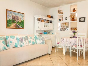 Couch, Property, Picture Frame, Furniture, Table, Plant, Textile, Living Room, Interior Design, Shelf