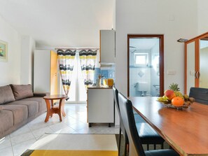 Table, Furniture, Couch, Cabinetry, Plant, Building, Picture Frame, Chair, Orange, Living Room