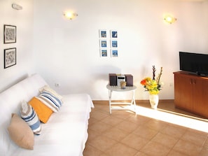 Room, Property, Furniture, Interior Design, Yellow, Living Room, Floor, Wall, Building, Real Estate
