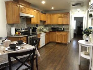 Kitchen with complete amenities as you would in your house & dinner table for 4