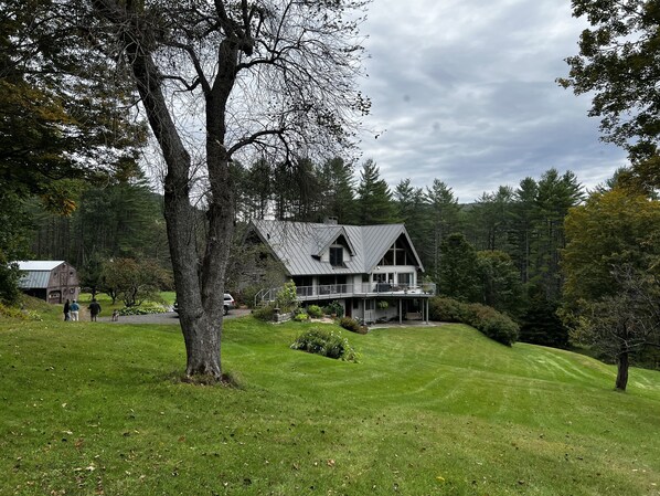 Summer view of the main lodge from the apple orchard.