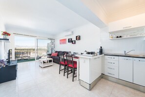 Modern kitchen with island, open to the living room