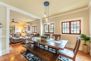 Enjoy meals together in the farmhouse-style dining area, complete with a large table that comfortably seats your group. Perfect for family meals, game nights, or planning your next adventure