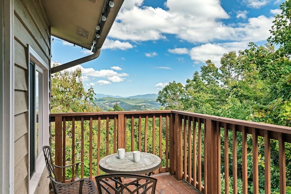 Perfect spot for morning coffee. Enjoy the mountain, city and lush forest views