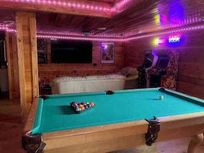 Game room with pool table, arcades, foosball and smart TV!