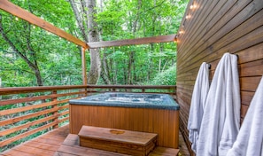Take a dip and relax while surrounded by huge trees in a peaceful wooded setting