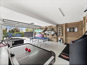 The games room offers hours of fun, equipped with a foosball table, ping pong table, old school arcade game and more.