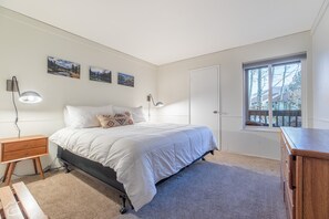 Downstairs bedroom with a king bed