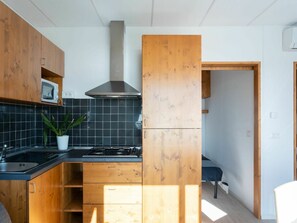 Cabinetry, Furniture, Building, Countertop, Wood, Interior Design, Kitchen Appliance, Shelving, Floor, Kitchen