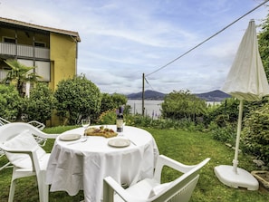 Cloud, Sky, Property, Plant, Table, White, Tableware, Chair, Tablecloth, Building