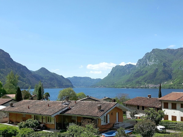 Sky, Cloud, Mountain, Water, Water Resources, Property, Building, Tree, Plant, Window