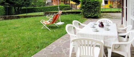 Property, Outdoor Table, Table, Furniture, Yard, Umbrella, Patio, Grass, House, Lawn