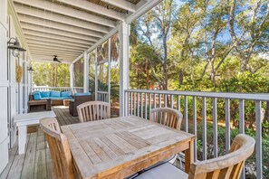 Outdoor dining on screened-in front porch