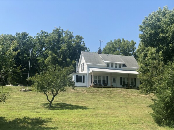 Quaint vintage farmhouse tucked into the hillside of 20 wooded acres 