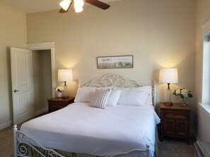 King-sized Master bedroom with luxury linens and blackout blinds.