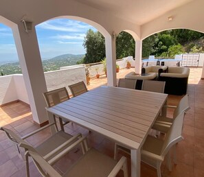 Dining table seating ten and space to relax on the main terrace