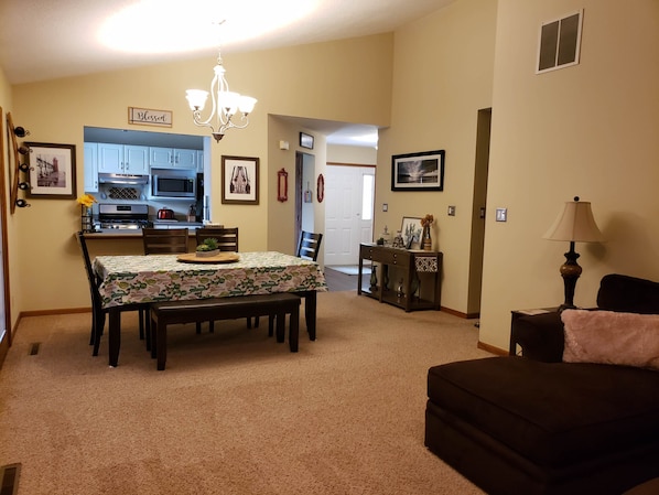 View from Living Room to open Dining Room. Kitchen beyond dinning room. 