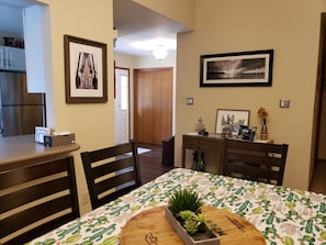 Dining area after foyer where front door and garage door come into the home. 