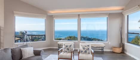 Ocean view living room w/ fireplace, flat screen TV