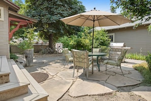 Relax on the back patio at Hyde Park Craftsman