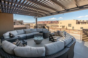 Front Patio View - The Front Patio can comfortably accommodate a large group of adults and is the perfect place to relax while enjoying a beautiful sunset