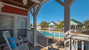 Porch to Patio - Beach Therapy has a private access gate to the community pool and hot tub.