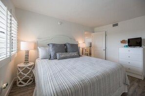Guest bedroom with plush king bed