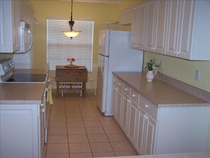 Kitchen with breakfast nook for morning sunshine.