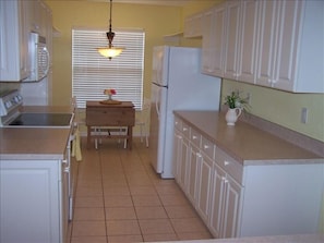 Kitchen with breakfast nook for morning sunshine.