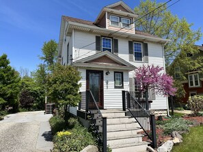 Driveway leads to the back of the house for more parking. Accommodates 6 cars.