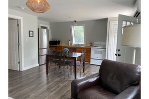 Open living space with galley kitchen 