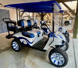 Custom lifted 4 seat and/or 6 seat limo golf cart available for your stay