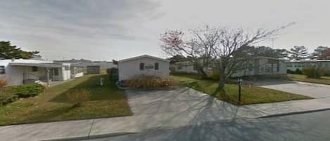 Google photo of vacation home. Parking pad for 2 cars.