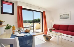 The bright living area is decorated in lively colours