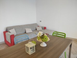 Table, Couch, Furniture, Rectangle, Studio Couch, Interior Design, Pillow, Living Room, Floor