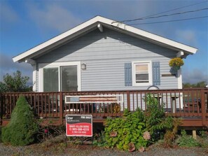 View of cottage from quiet, street with very low foot or car traffic