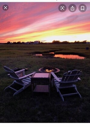 Enjoy the fire pit and breathtaking views just a short walk from the beach