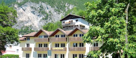 Plant, Building, Sky, Mountain, Car, Tree, Window, Natural Landscape, House, Neighbourhood