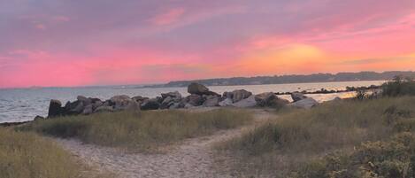 The secluded neighborhood beach is footsteps away from the cottage.