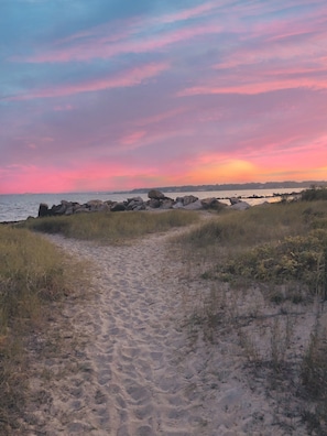 The secluded neighborhood beach is footsteps away from the cottage.