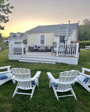 In 2023 we added a large deck for dining & relaxing with views of Buzzard's Bay.