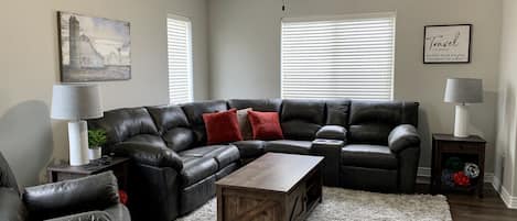 Comfortable seating for 7. Sectional has recliners at each plus reclining chair.