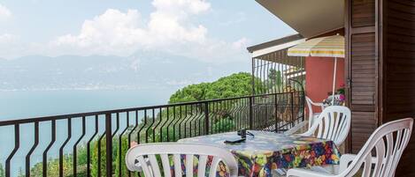 Sky, Cloud, Furniture, Property, Table, Chair, Plant, Water, Building, Azure