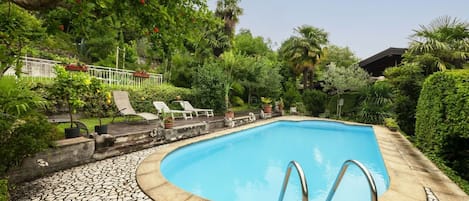 Water, Plant, Sky, Swimming Pool, Building, Tree, Chair, Azure, Shade, Outdoor Furniture