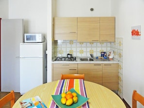 Room, Orange, Furniture, Property, Interior Design, Yellow, House, Wall, Shelf, Building