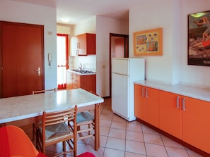 Room, Orange, Property, Furniture, Building, Red, Interior Design, Kitchen, House, Cabinetry