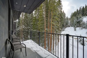 Private deck off living room with views of the Corridor Trail