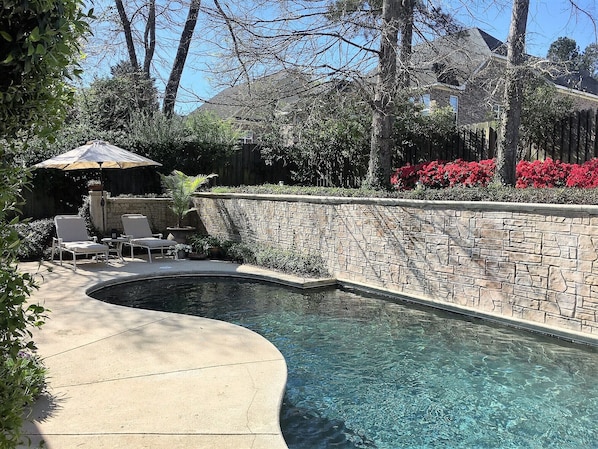 Private pool with 3 waterfalls from the retaining wall.