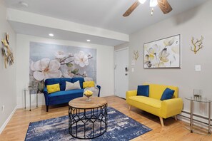 Smartly designed common space with a comfy couch, smart TV, and nice natural light.  All you have to do is log into your favorite streaming services and make it a TV night.
